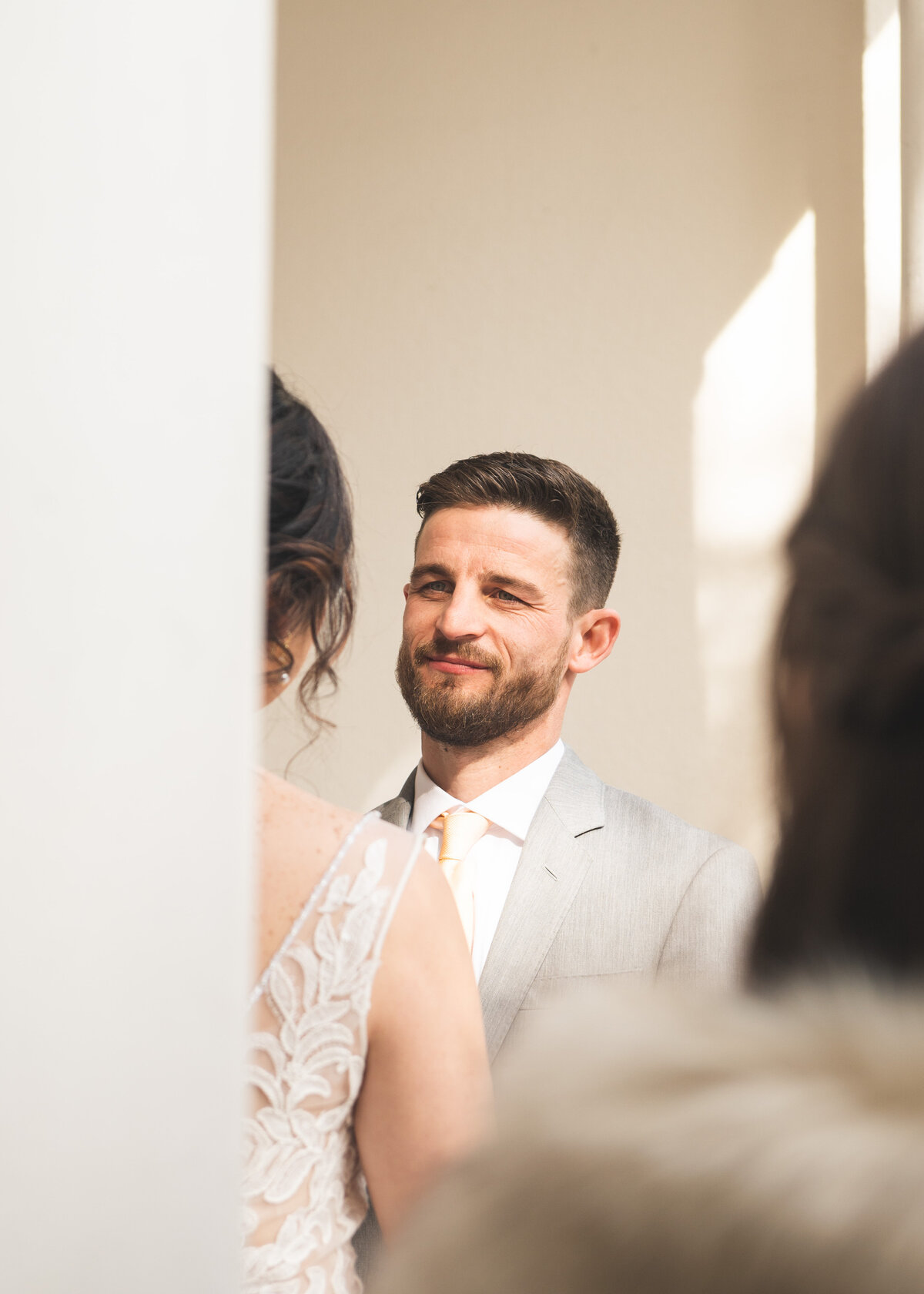 kacy beck wedding photography gig harbor washington wedding inspiration the groom takes his first look at the bride walking down the aisle in the pacific northwest