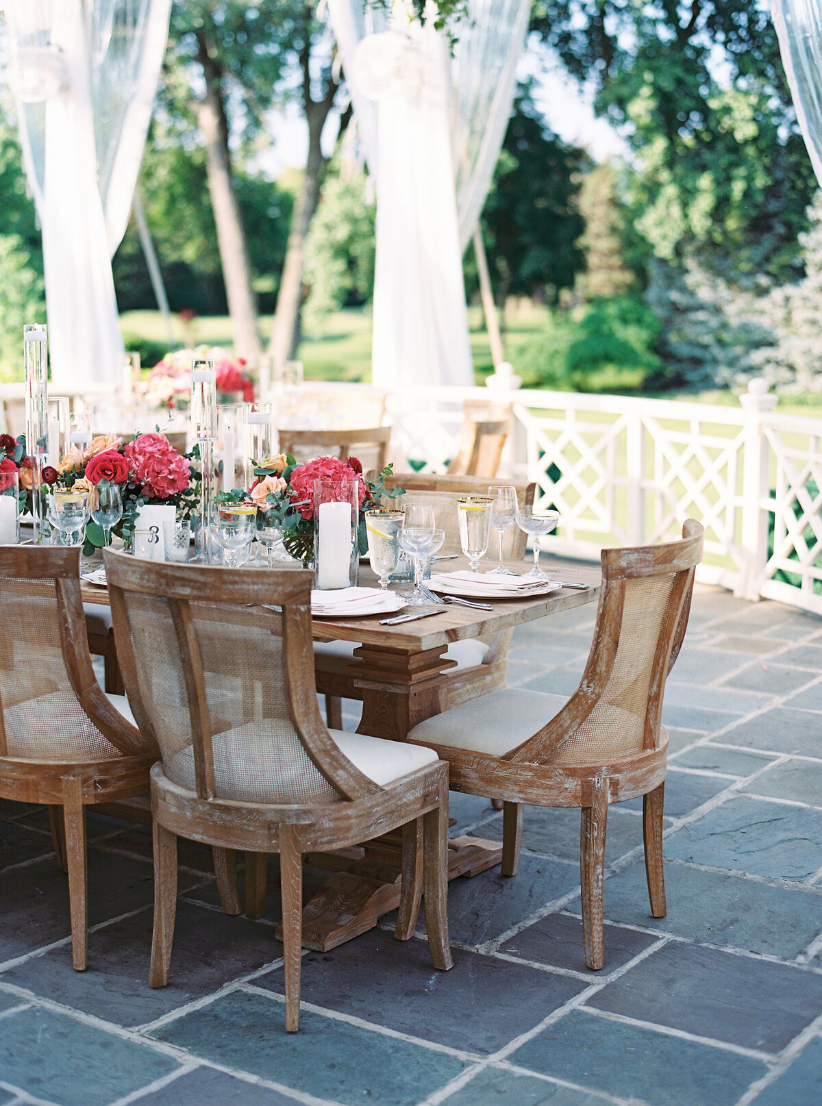 A serene outdoor dining area with elegant table settings at Saddle Country Club.