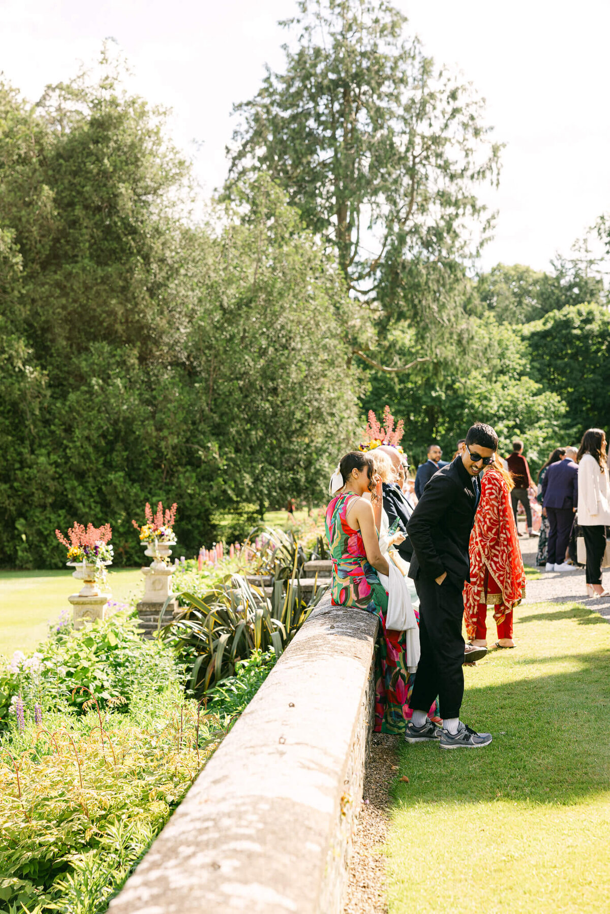 A wedding photo of guests during cocktail hour at Luttrellstown Castle in Ireland