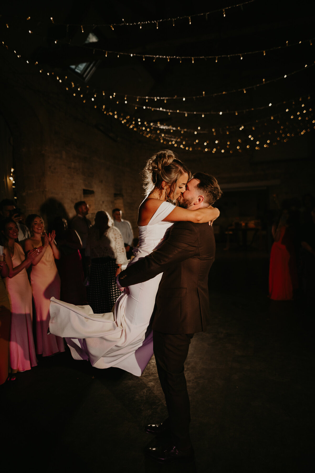 Bride is spun around by groom during their first dance at Lapstone Barn.