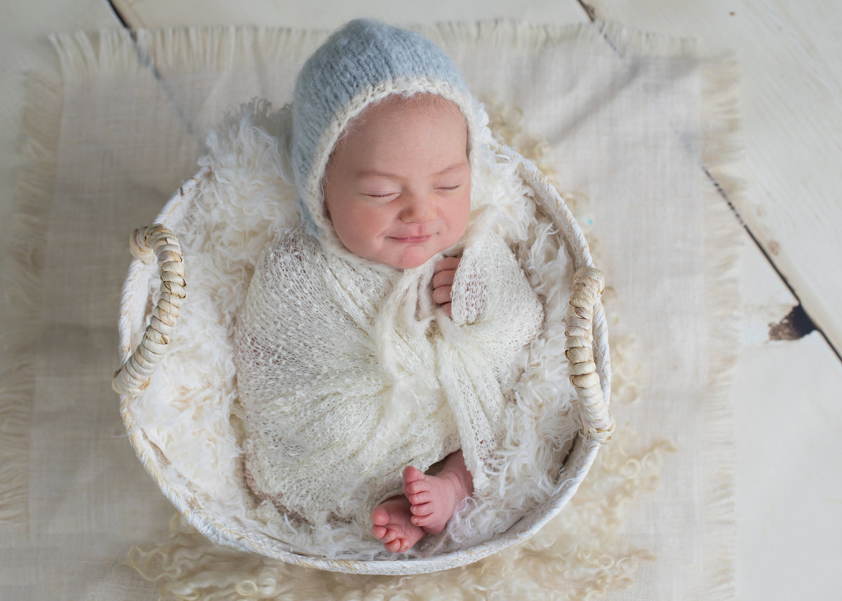 Sweet newborn girl wrapped up tight