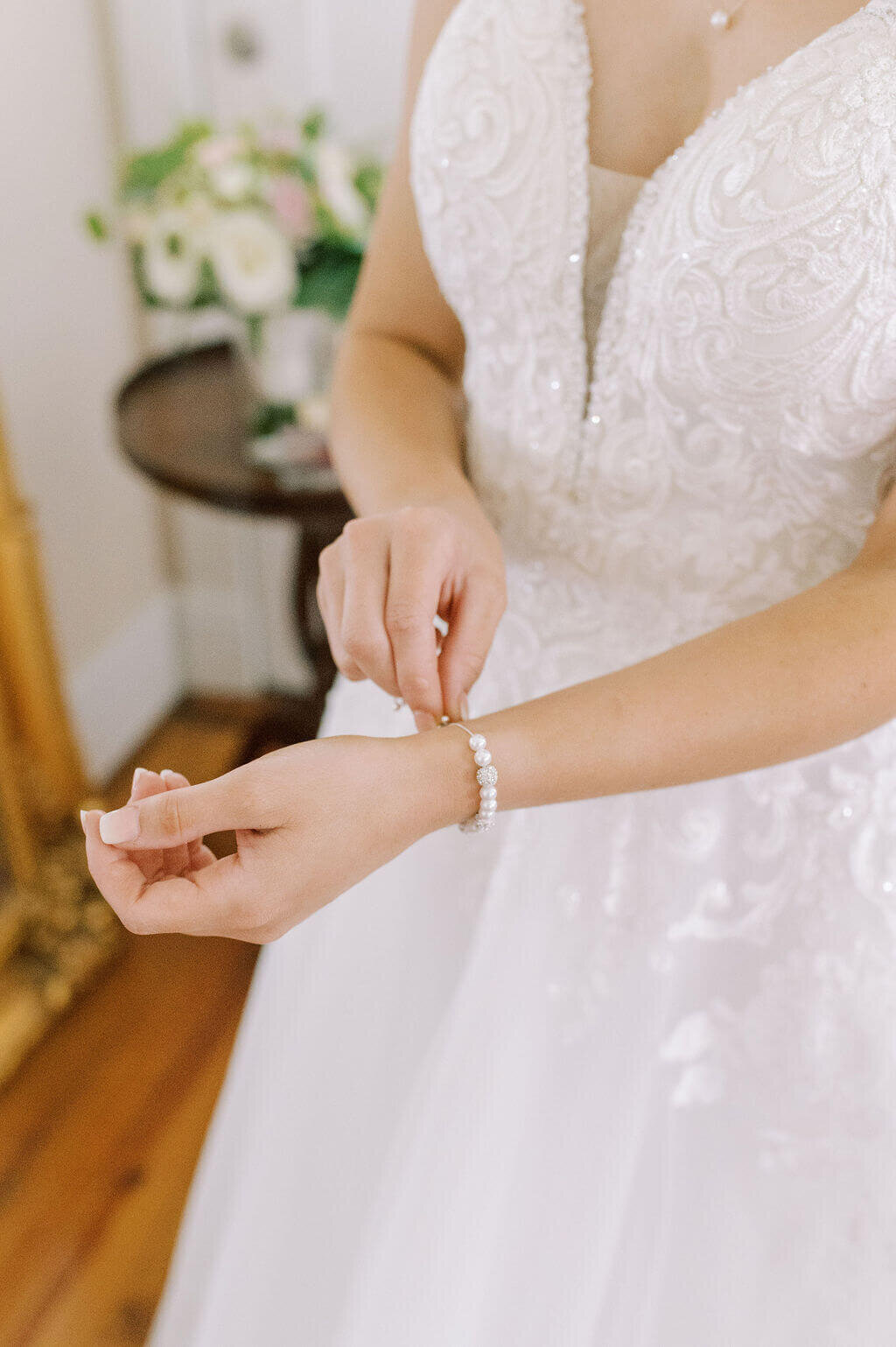 bride adjusting bracelet during getting ready photos