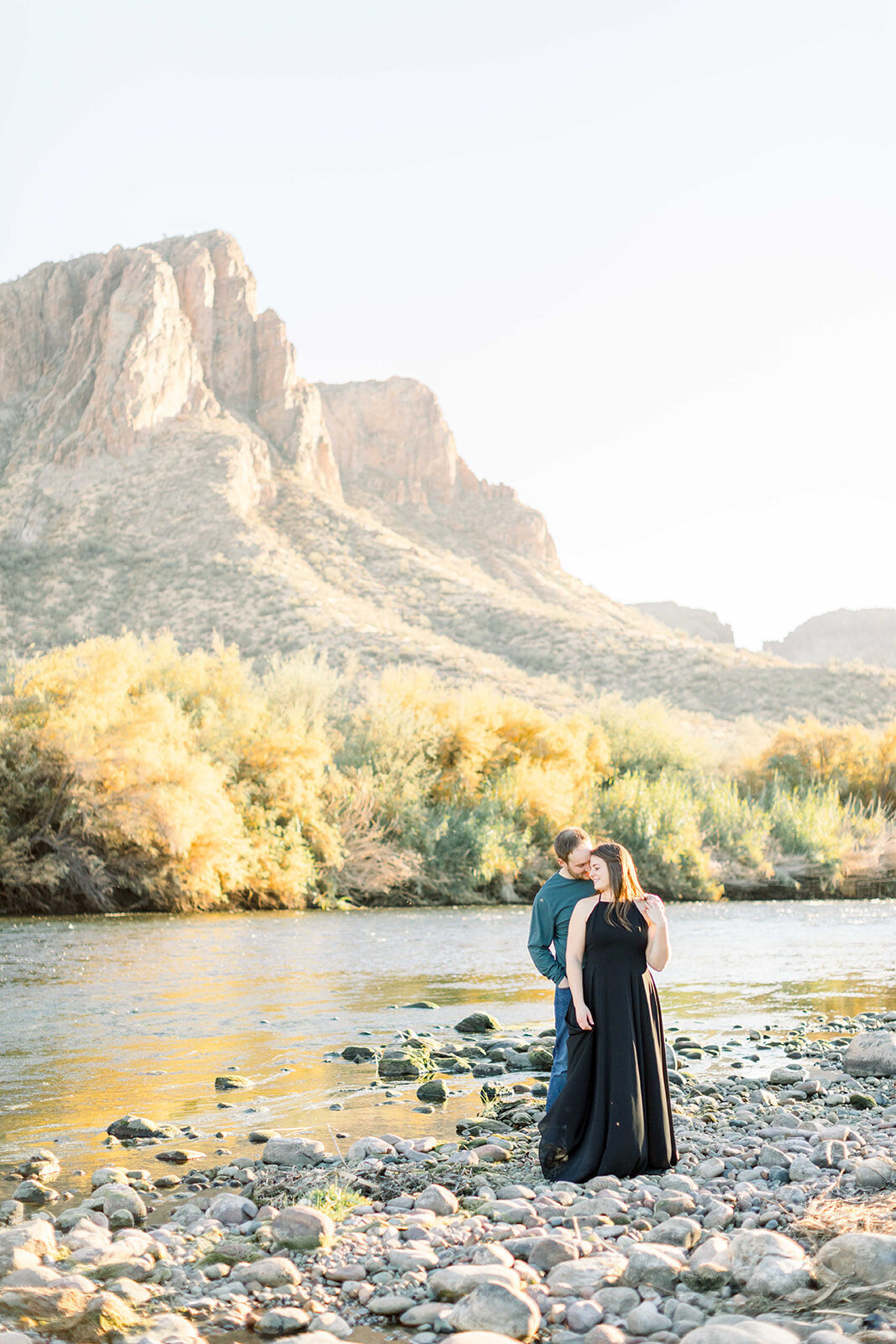 Couple standing by a river in Scottsdale, Arizona by Kelby Maria