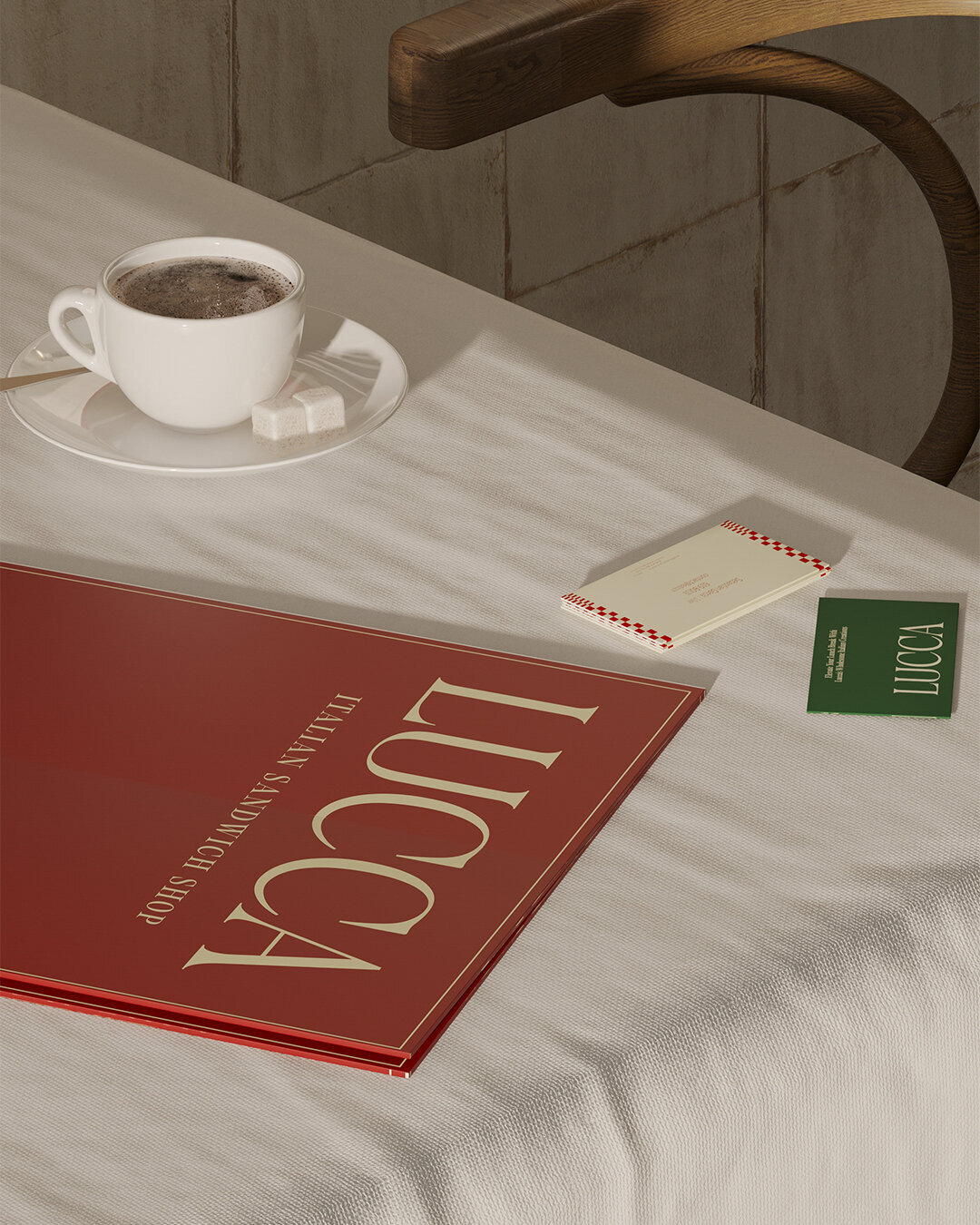 LUCCA brand identity with timeless packaging design, featuring branded coffee cups and takeaway bag at Italian café table.