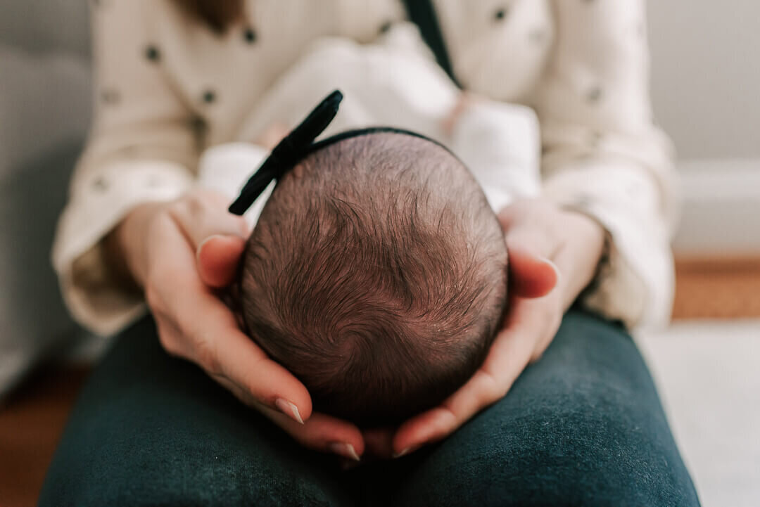 a close up shot of a baby's crown of hair