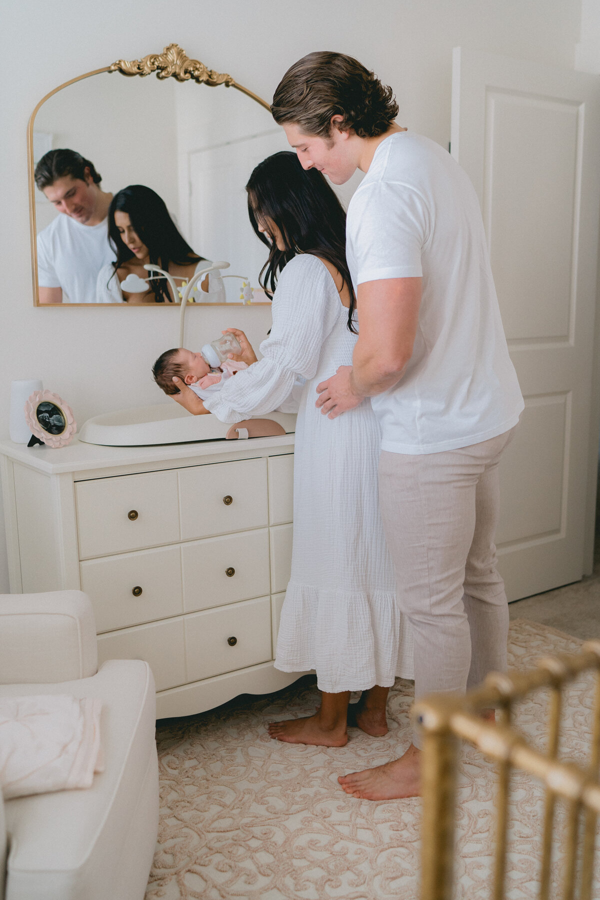 parents feeding newborn photos