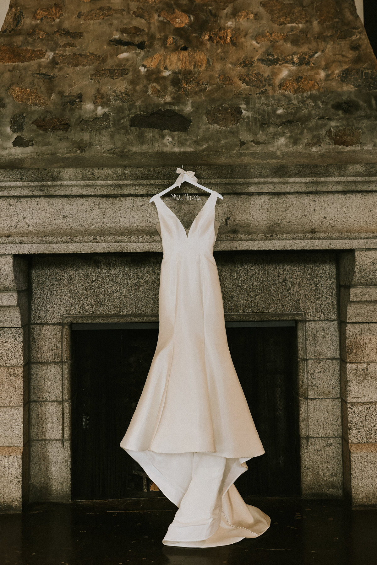 wedding-dress-hanging-detail-shot-saint-clements-castle