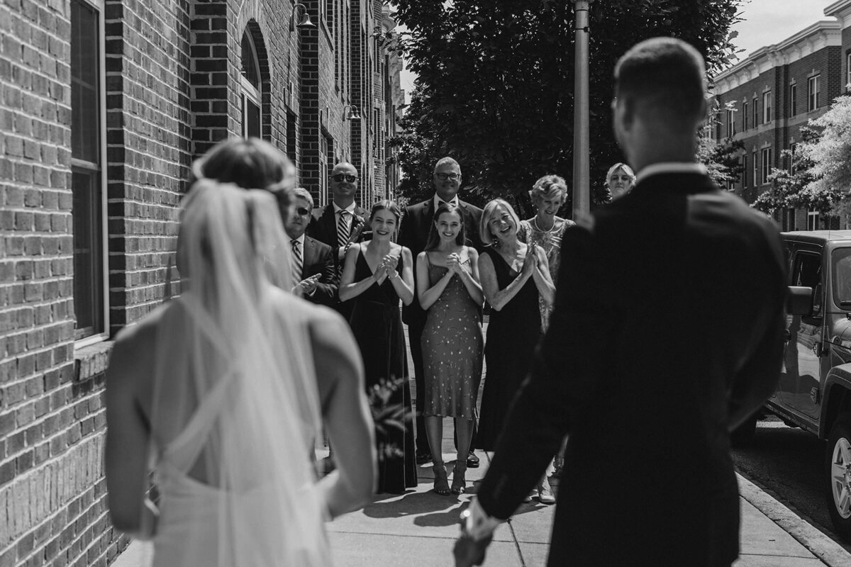 A couple doing a first look with their families 