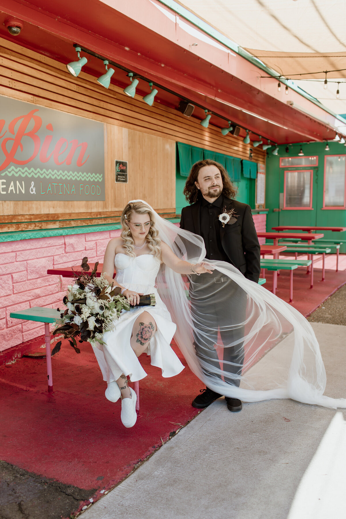 A colorful and urban wedding portrait at Un Bien in Seattle. Captured by Fort Worth Wedding Photographer, Megan Christine Studio