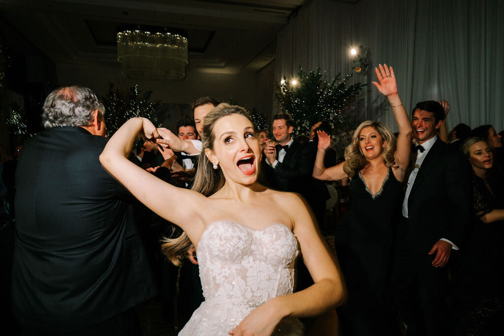 Bride having a good time on the dance floor. 