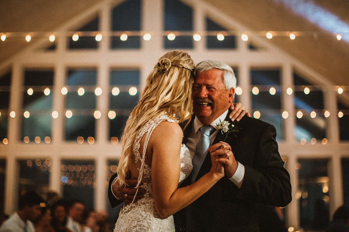father daughter dance at wedding  with twinkle lights