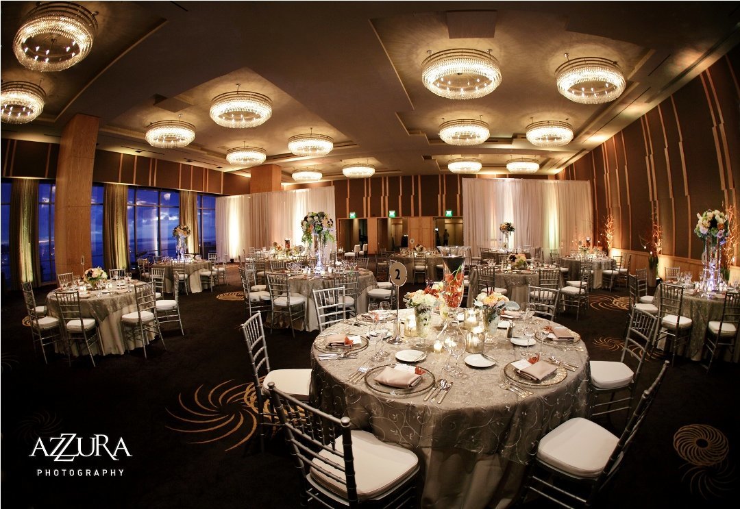 silver wedding anniversary party with grey linens, silver Chivari chairs, an luxurious centerpieces at Four seasons Seattle ballroom