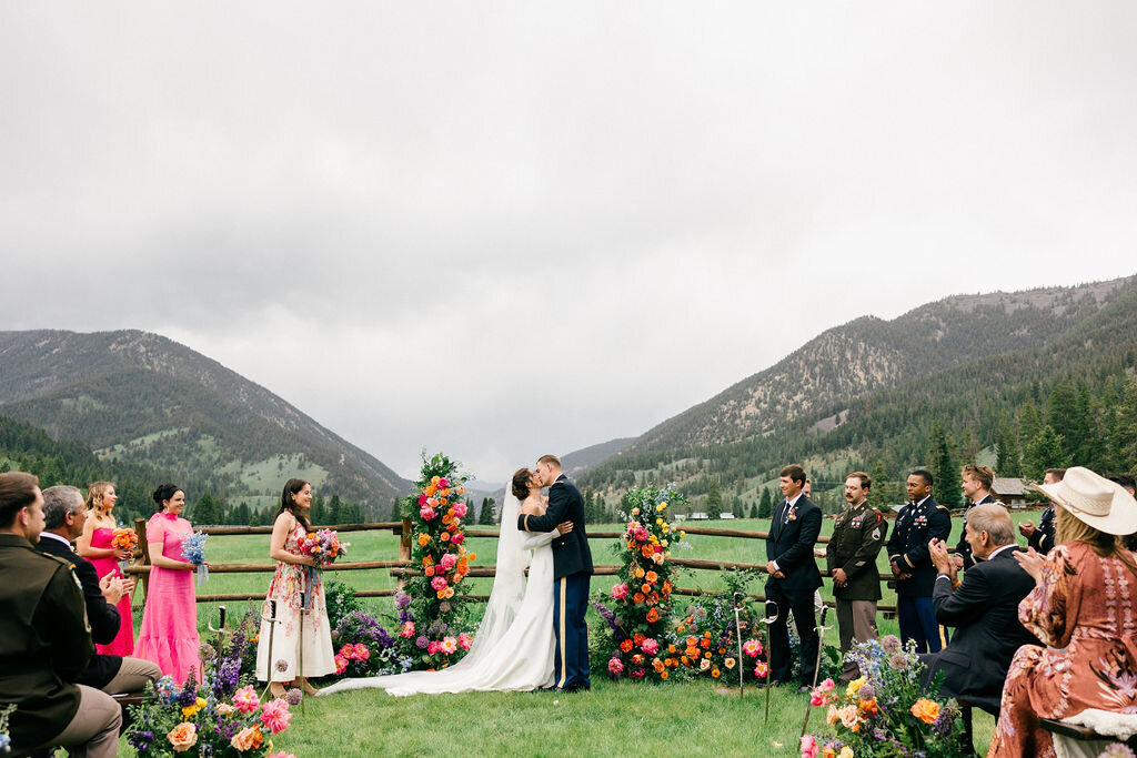 First kiss at outdoor ceremony in Big Sky Montana at 320 Guest Ranch