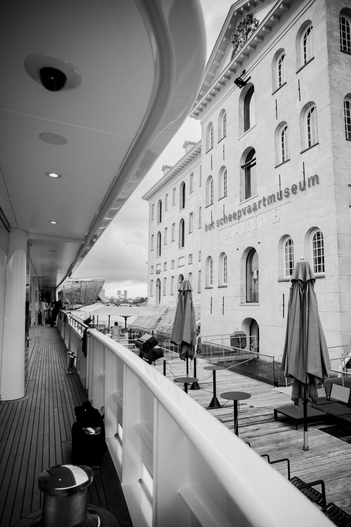 The iconic Scheepvaartmuseum in Amsterdam is beautifully framed from the deck of the Samadhi yacht. This image highlights the unique combination of historical architecture and modern luxury in event photography.