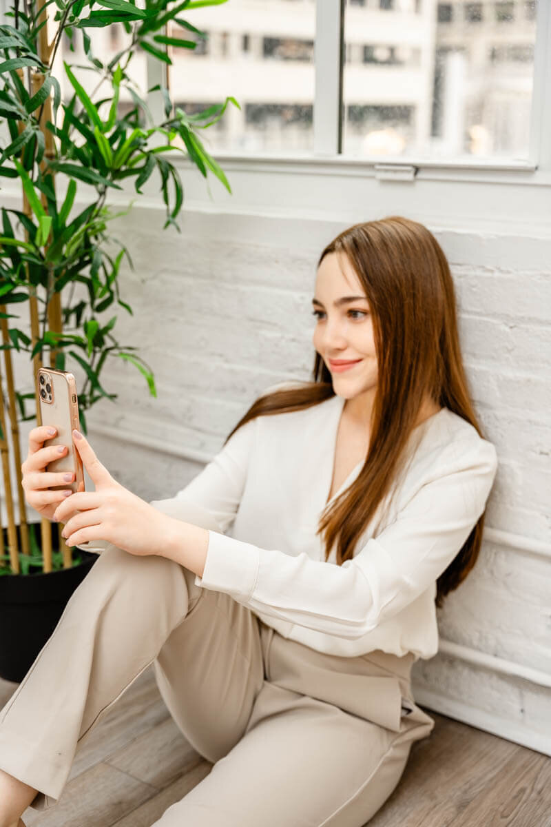 social media consultant on the phone taken by a maryland personal branding photographer