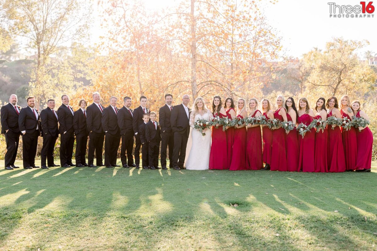 Bride and Groom pose with large wedding party