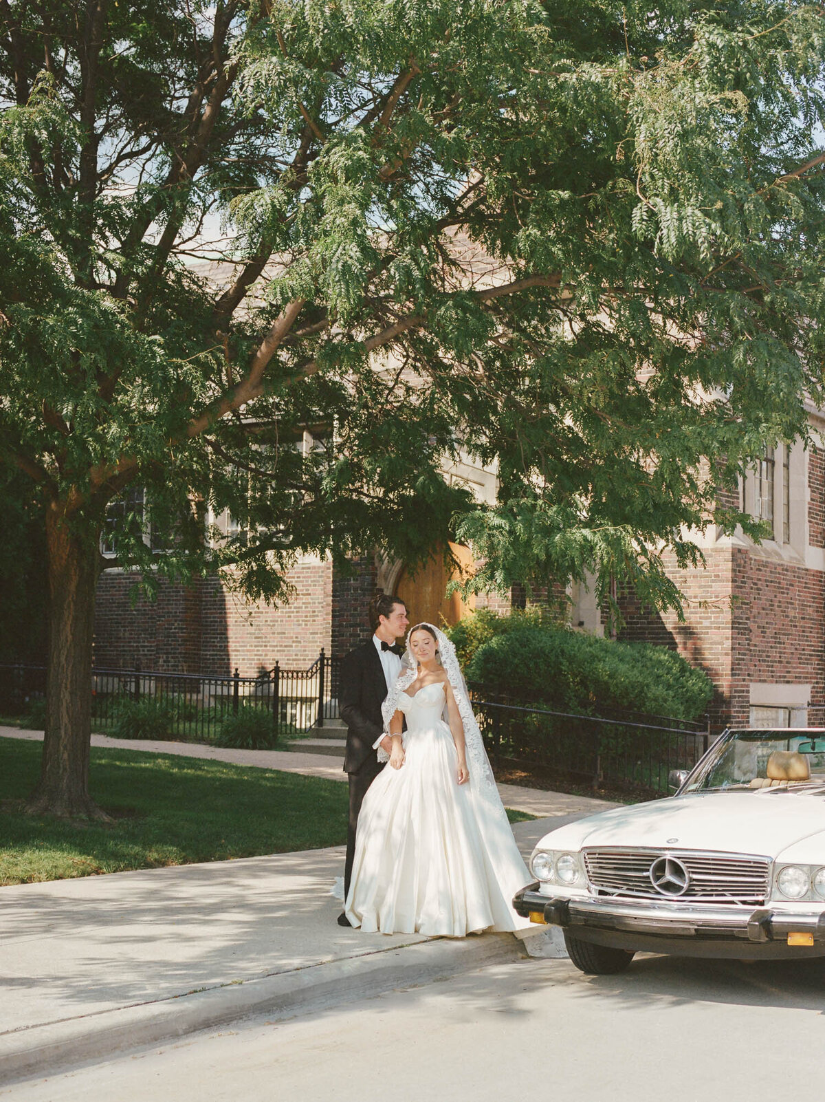 natural film wedding photography of a couple with vintage car in Detroit, Michigan