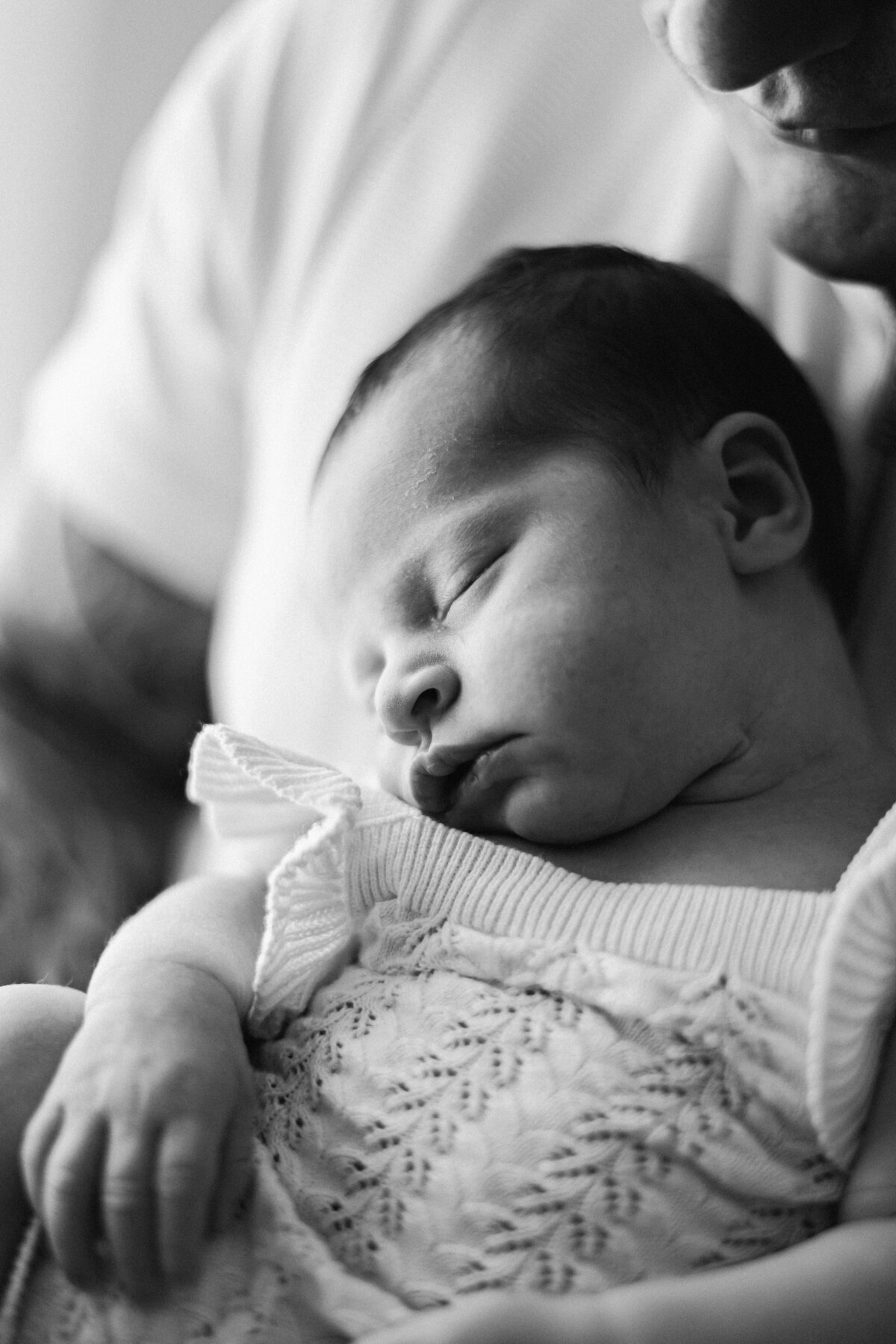 newborn baby sleeping on dads chest at billingshurst newborn photoshoot