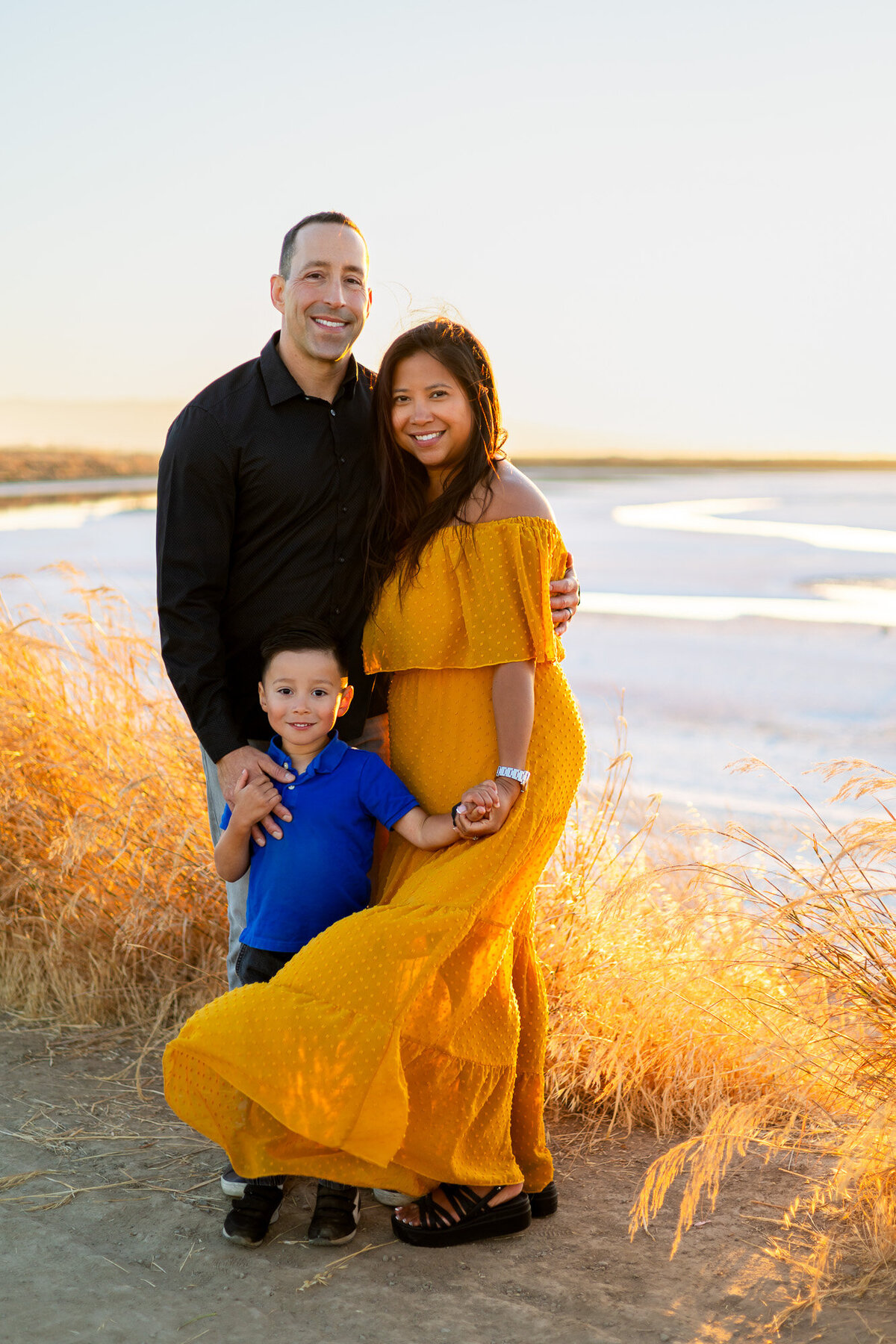Bay Area Family Portfolio sunset family photo with parents and child by the water - Ellobelle Photography