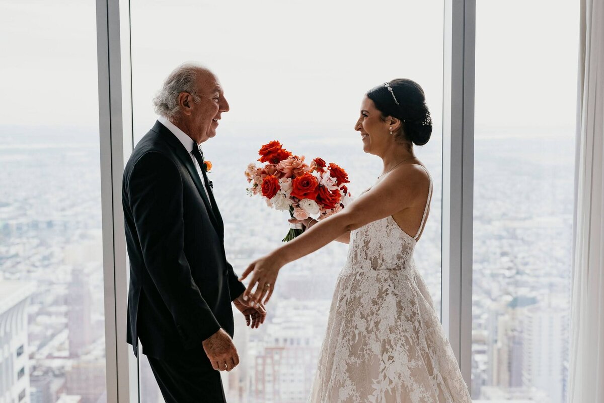 Father of the bride first look, bride holding bridal bouquet by Philadelphia Florist Sebesta Design
