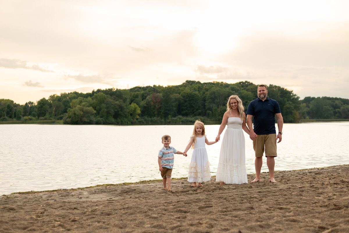 family-holding-hands-at-beach