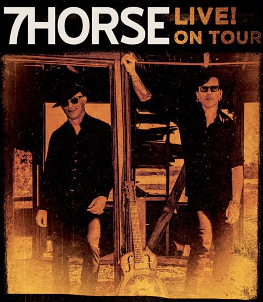 Tour Poster Music Duo 7horse standing in derest shack guitar leaning on post between them black and white image toned orange