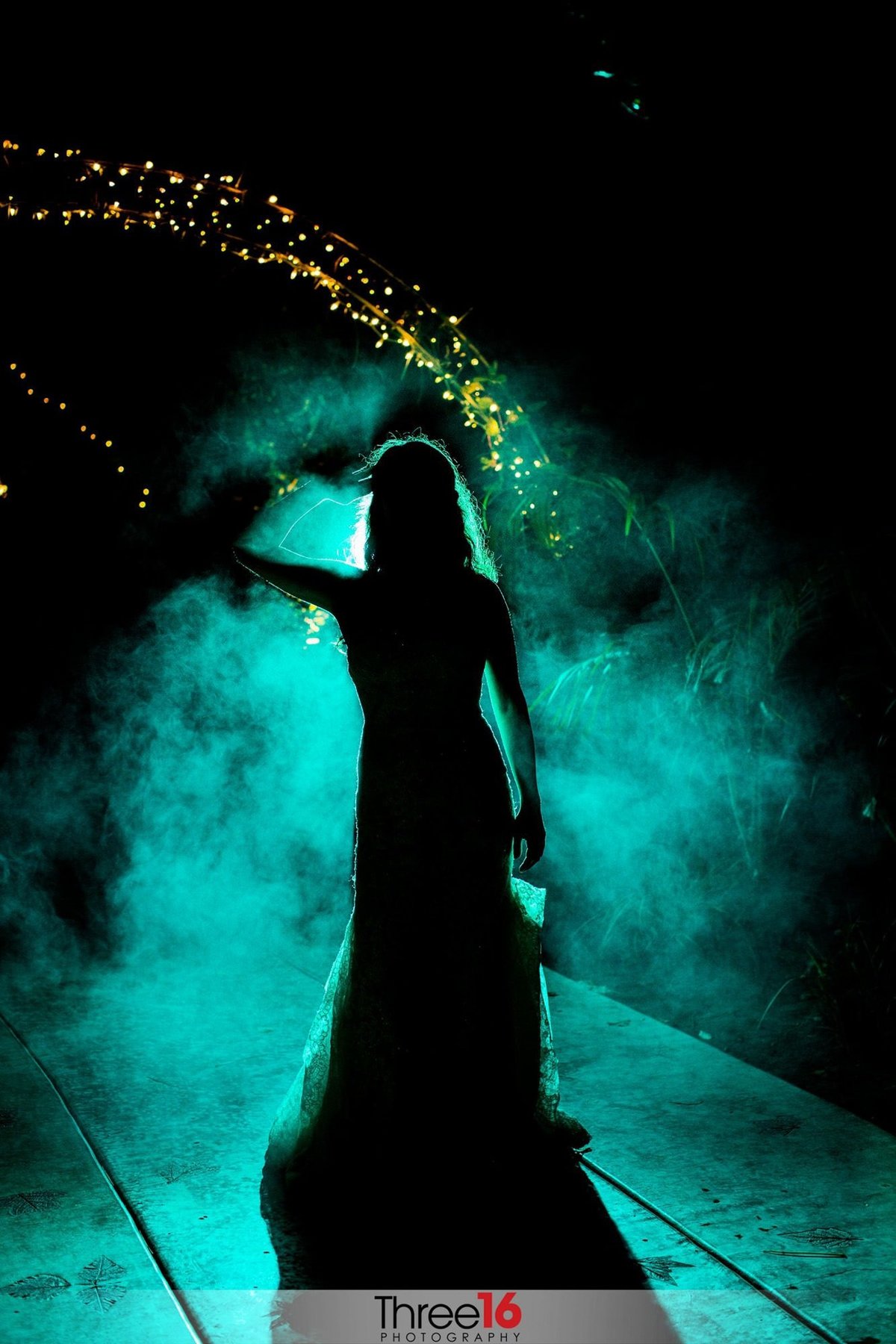 Silhouette of Bride at night with blue mist
