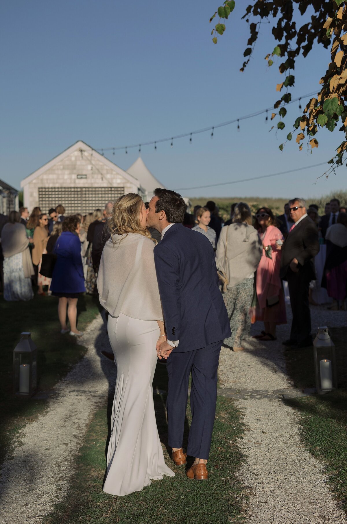 Bride and Groom walking to outdoor wedding reception on Nantucket.