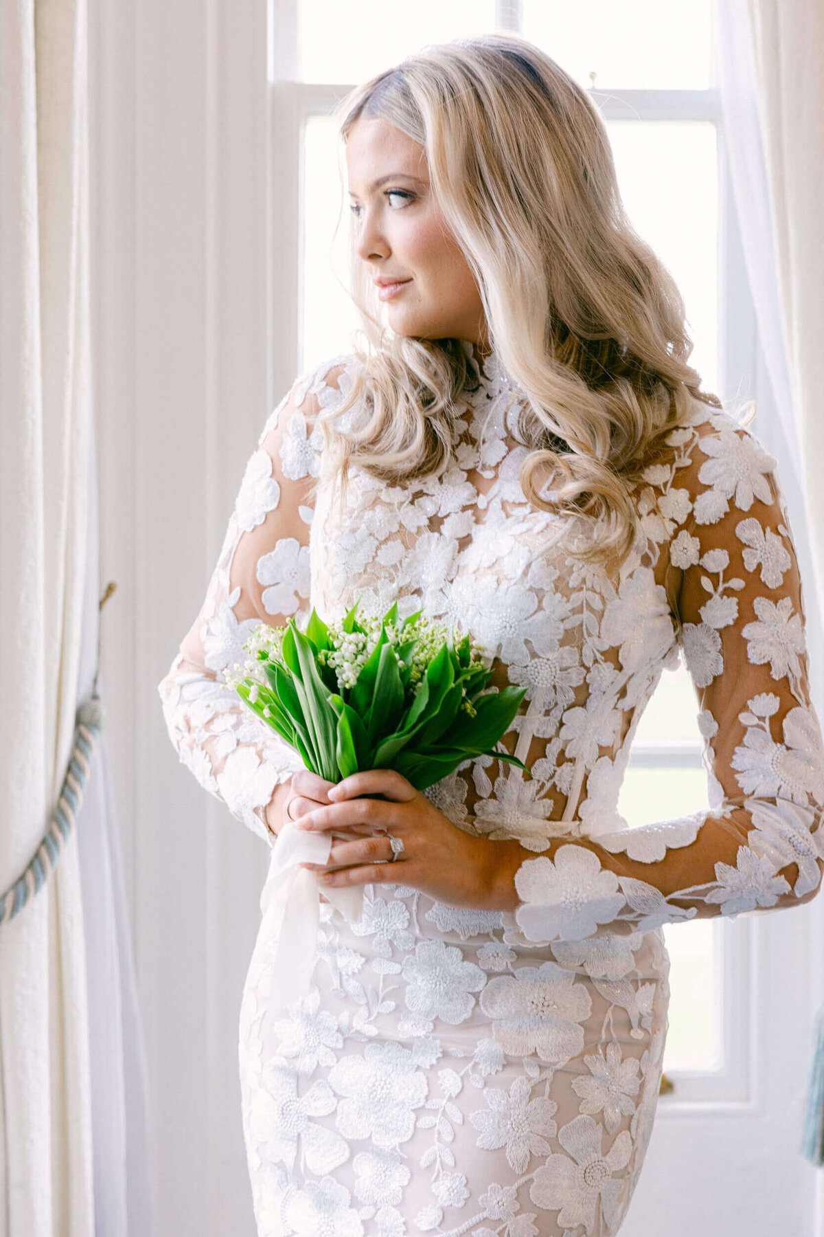 A wedding day portrait of the bride in her white wedding dress at Hedsor House in the UK