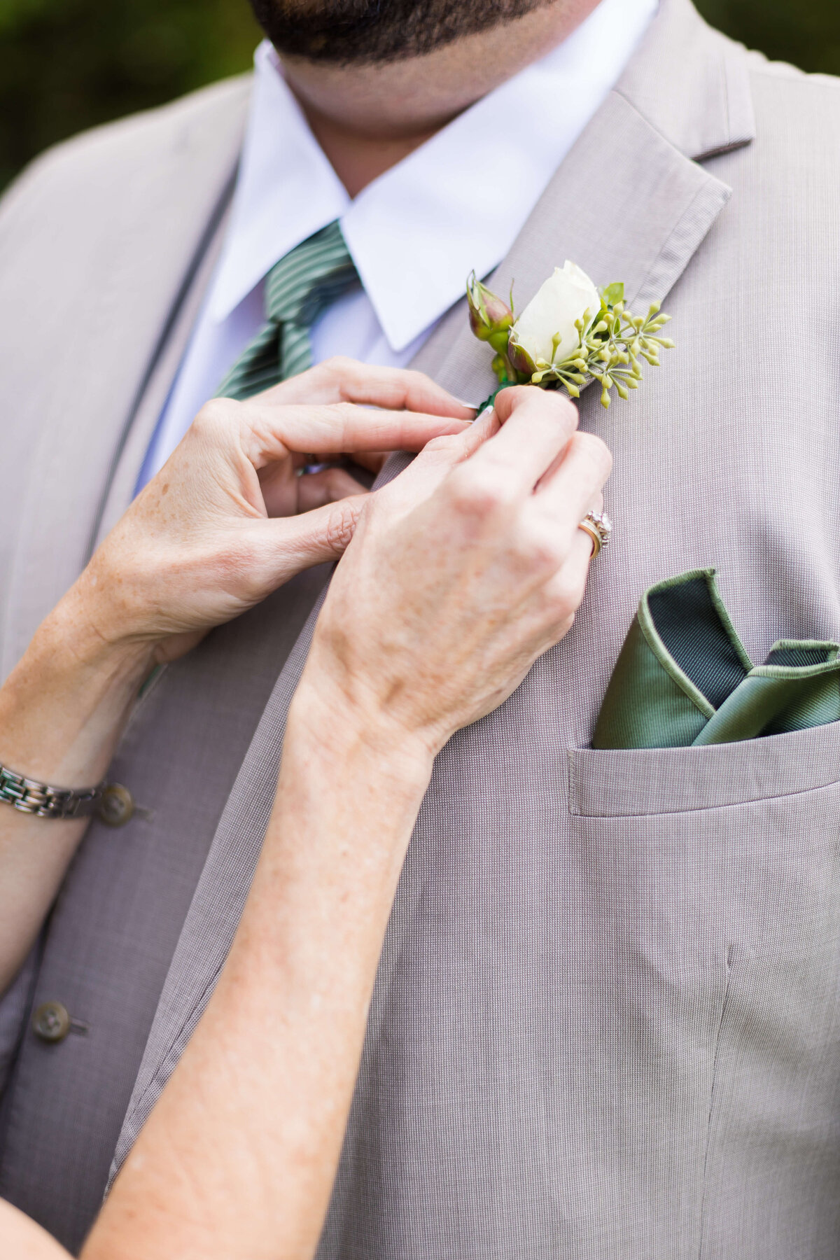 groom having boutainnaire attached