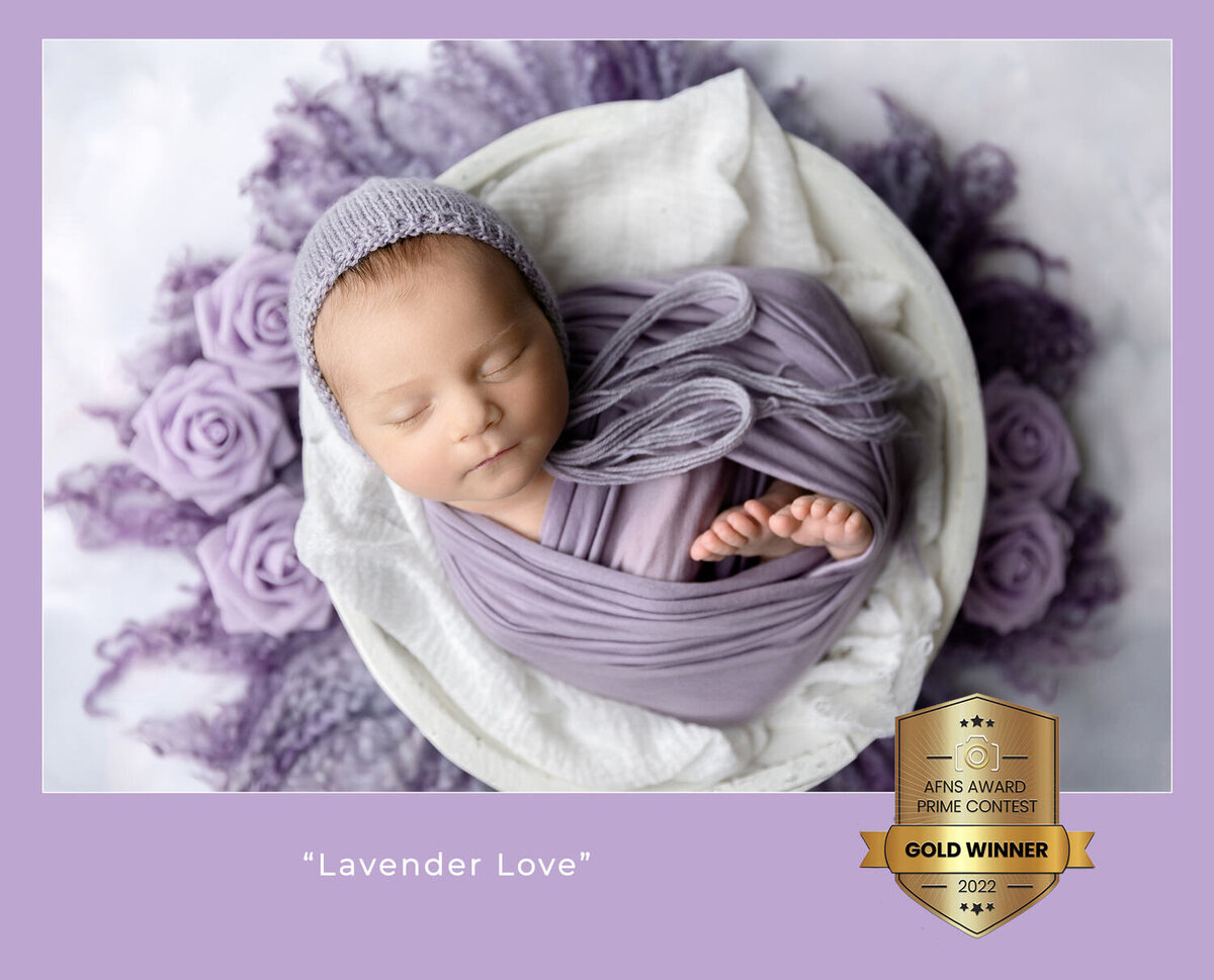 award winning newborn photo of a baby in a white bowl with purple accents