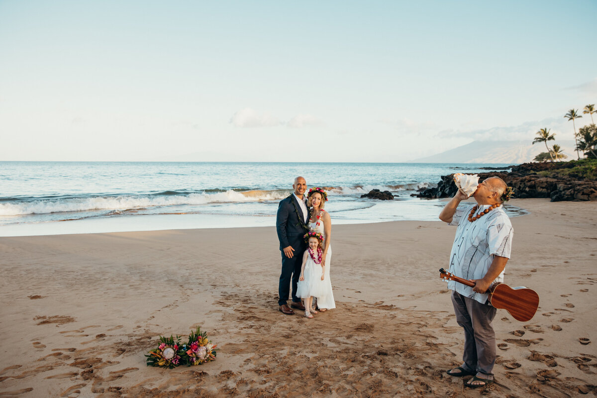 Maui Wedding Photographer captures bride and groom hugging after intimate wedding ceremony