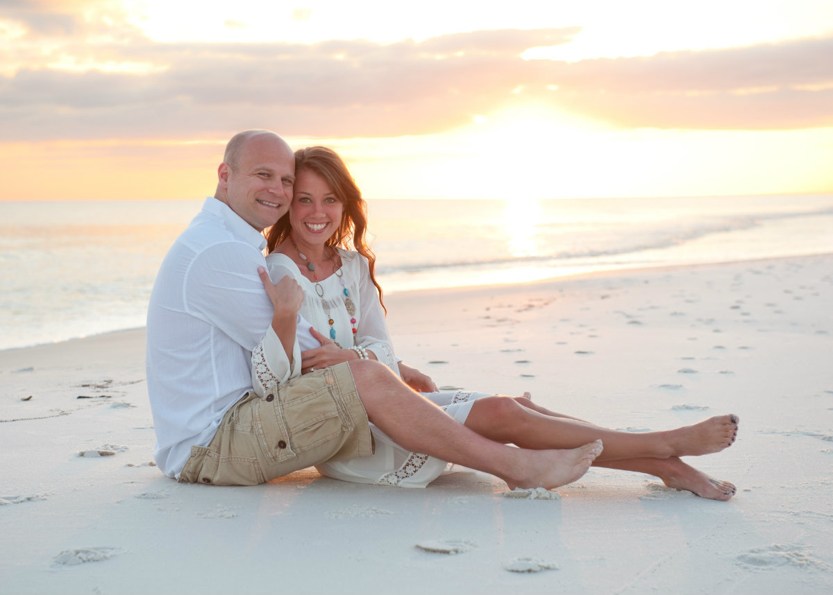 Couple posed on the Seagrove beach at sunset