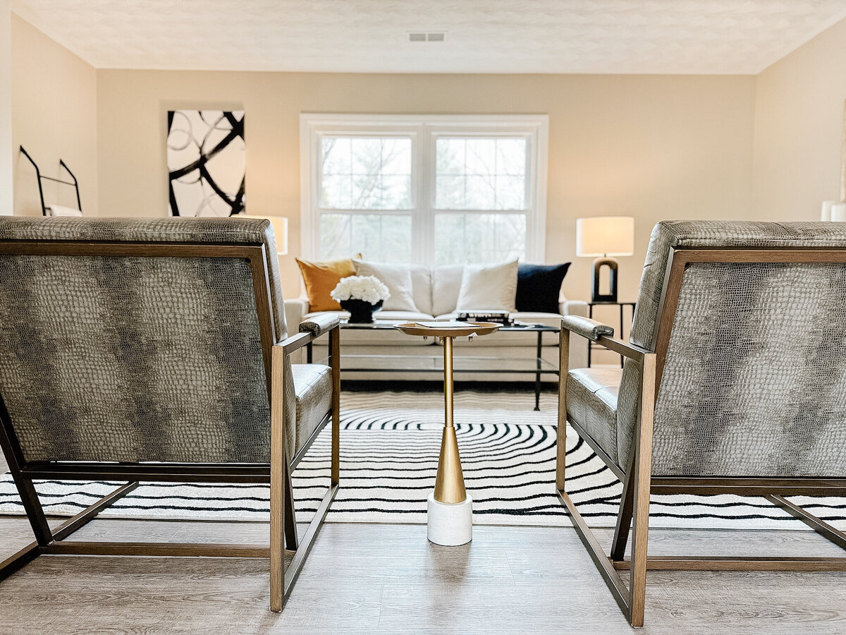 Seating area with snakeskin chairs