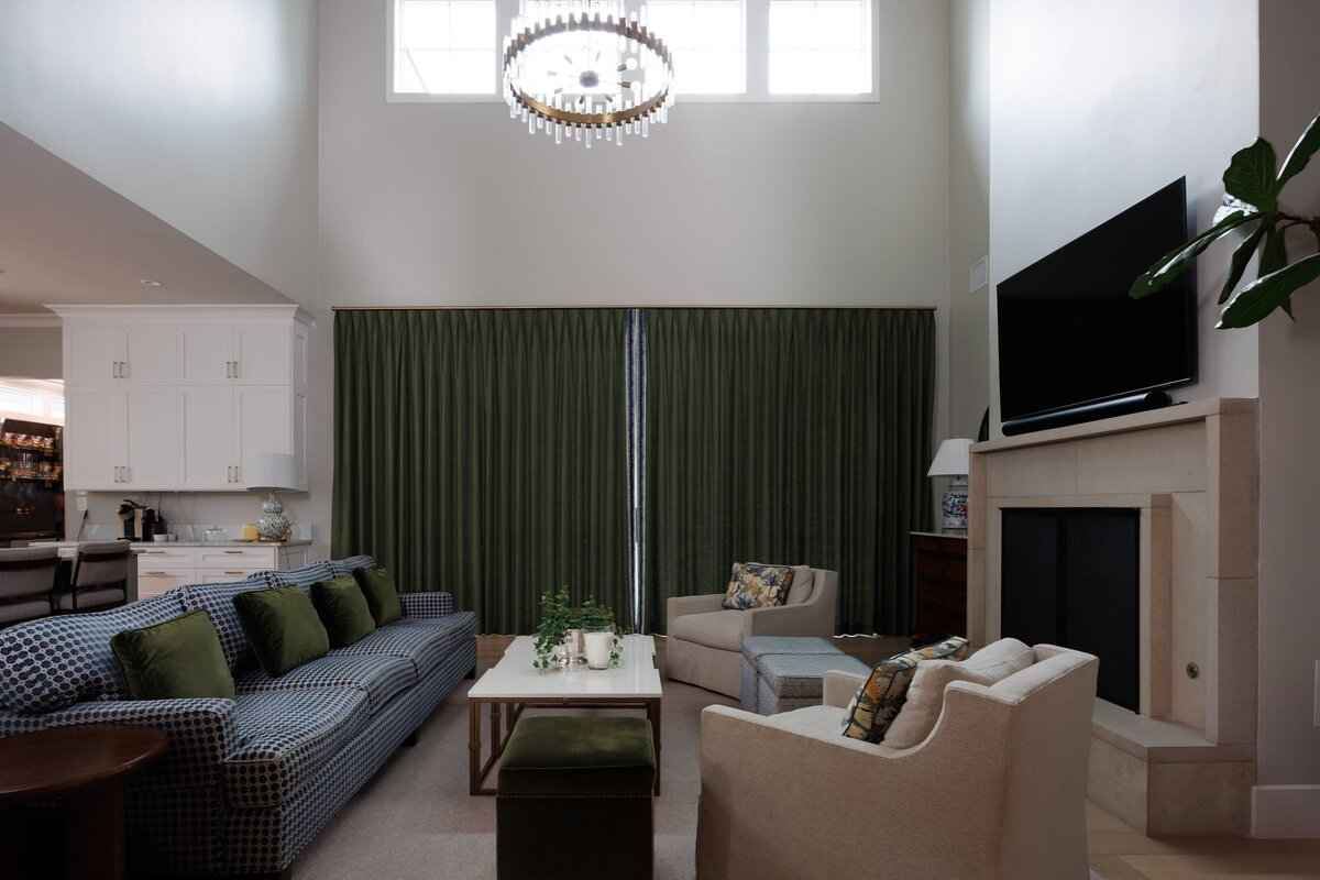 the keeping room interiors primera living room with green curtains and high ceilings