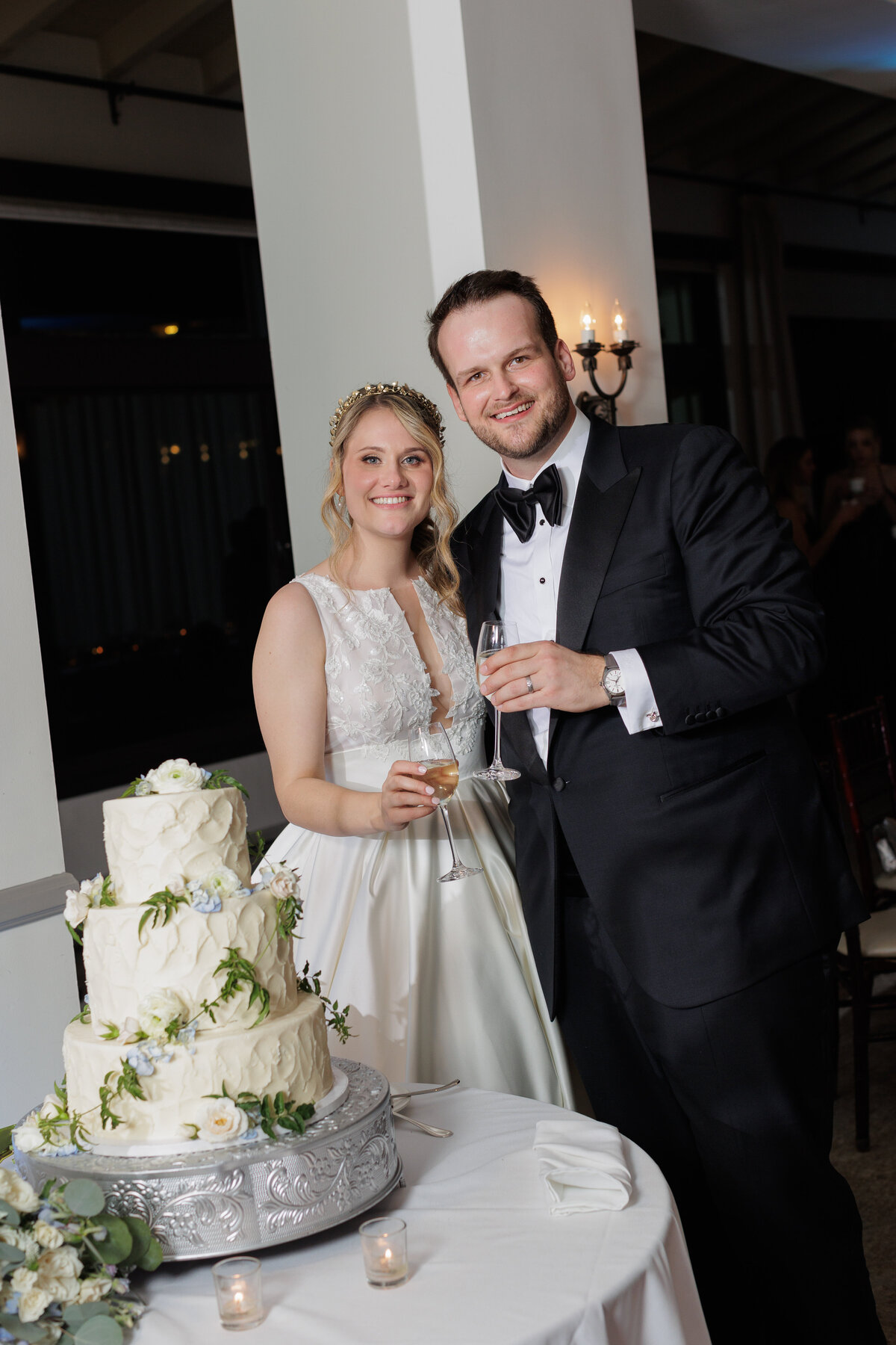 Bride and groom holing a glass of champagne