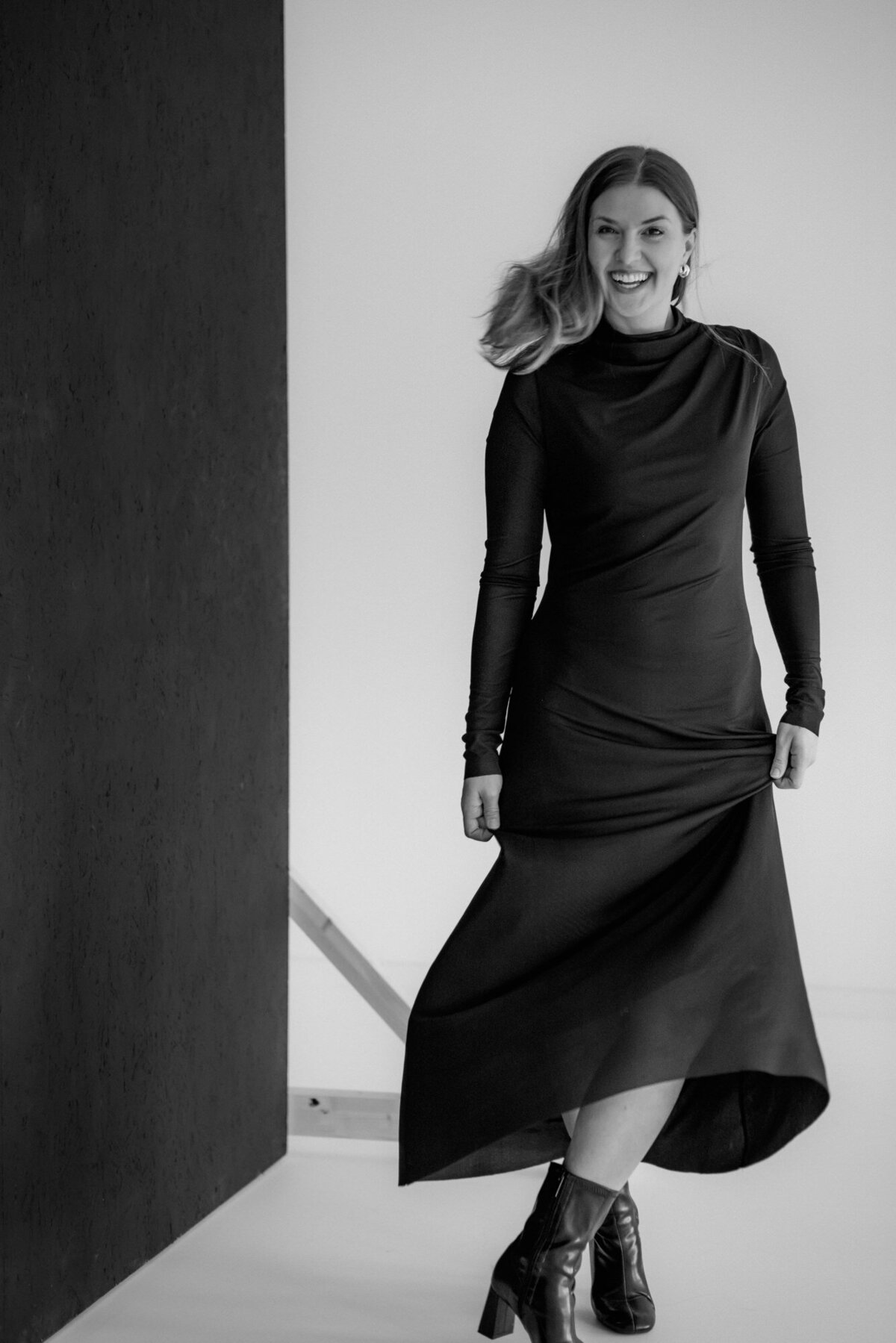 This woman dances with a long dress visibly having fun.