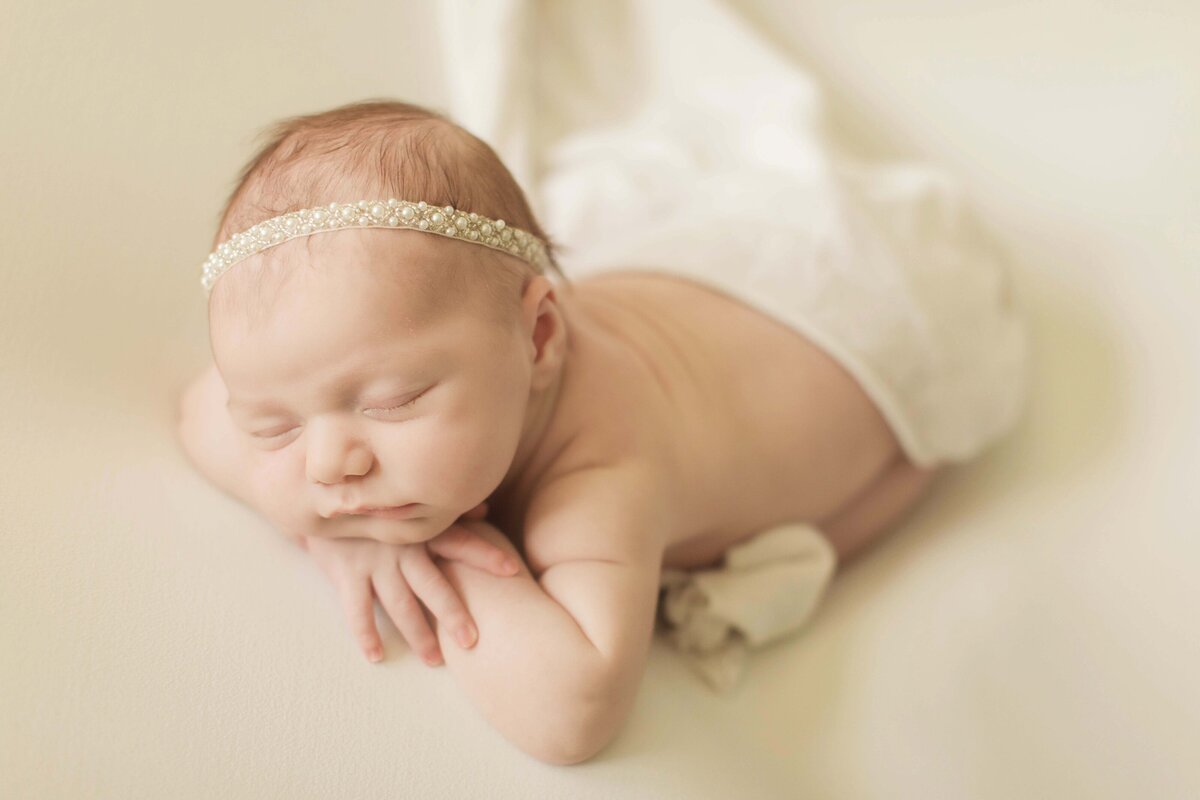 cincinnati in-home newborn session baby posed on light backdrop light and airy photography