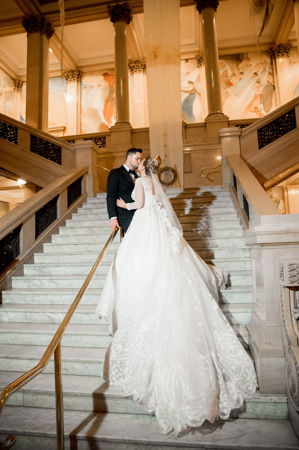 wedding photo on grand staircase at carnegie museum