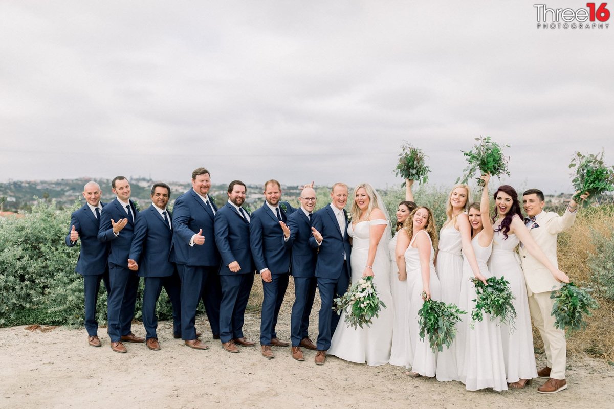 Bride and Groom pose for photo with Bridal Party