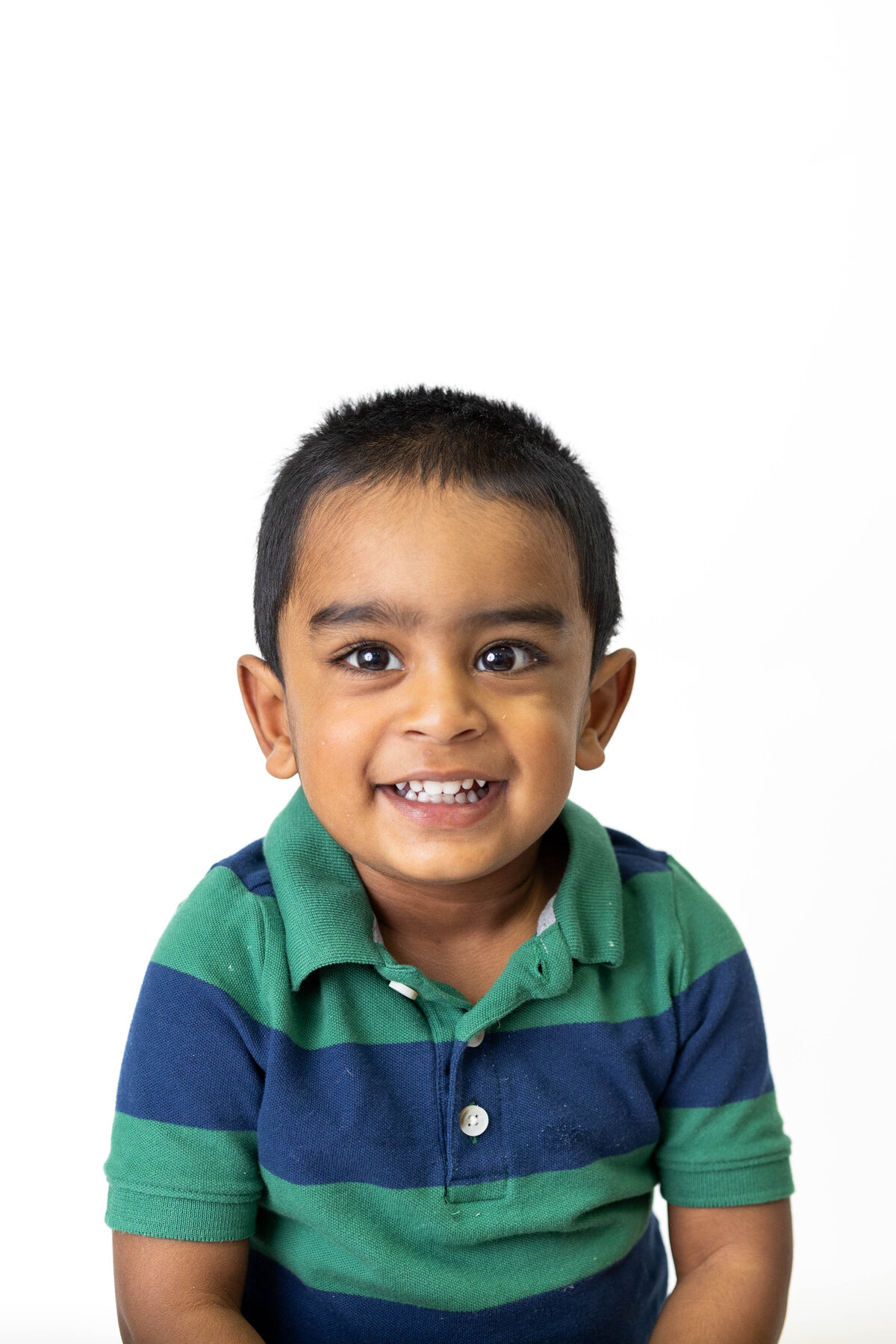 Smiling two year old boy in school photo Wellesley MA