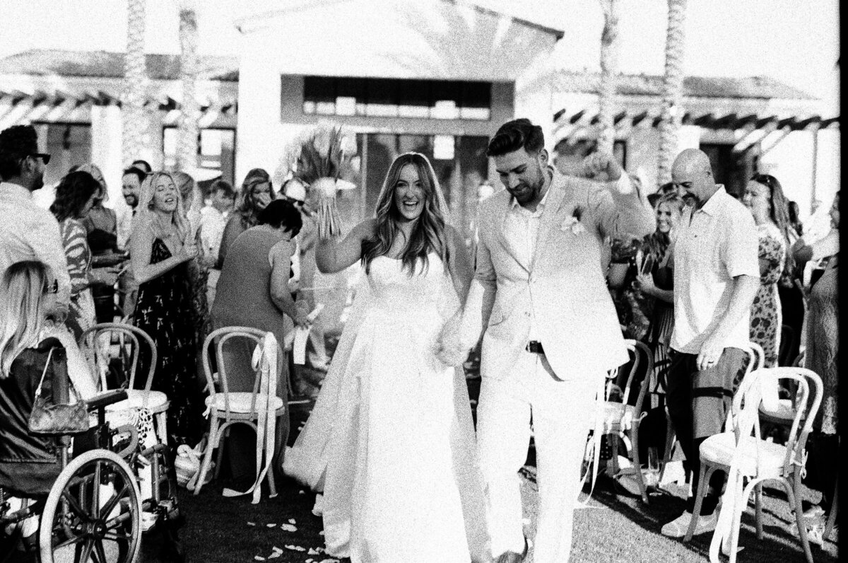 just maries walking down aisle black and white 35mmfilm Cache Estate