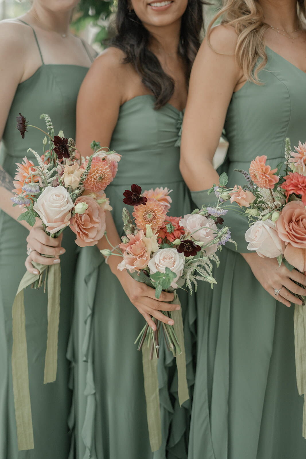 colourful-bridesmaids-bouquets-green-dresses-min