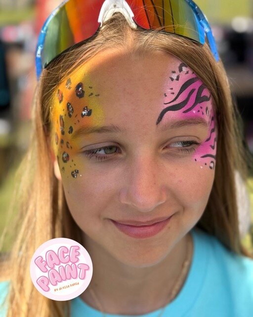 face-painting-by-alyssa-daken-Bemidji-pink-orange-yellow-animal-print-glitter-face-paint-design
