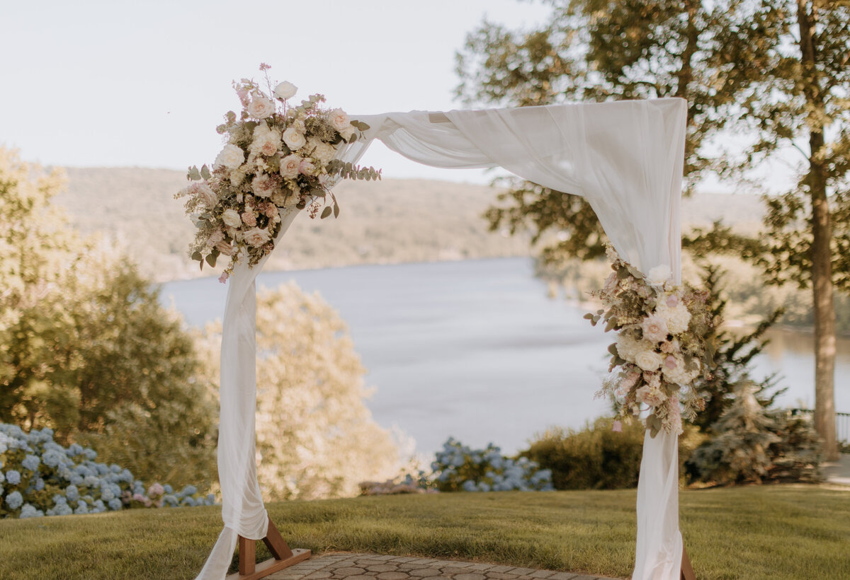 wedding-ceremony-flower-arch-at-saint-clements-castle