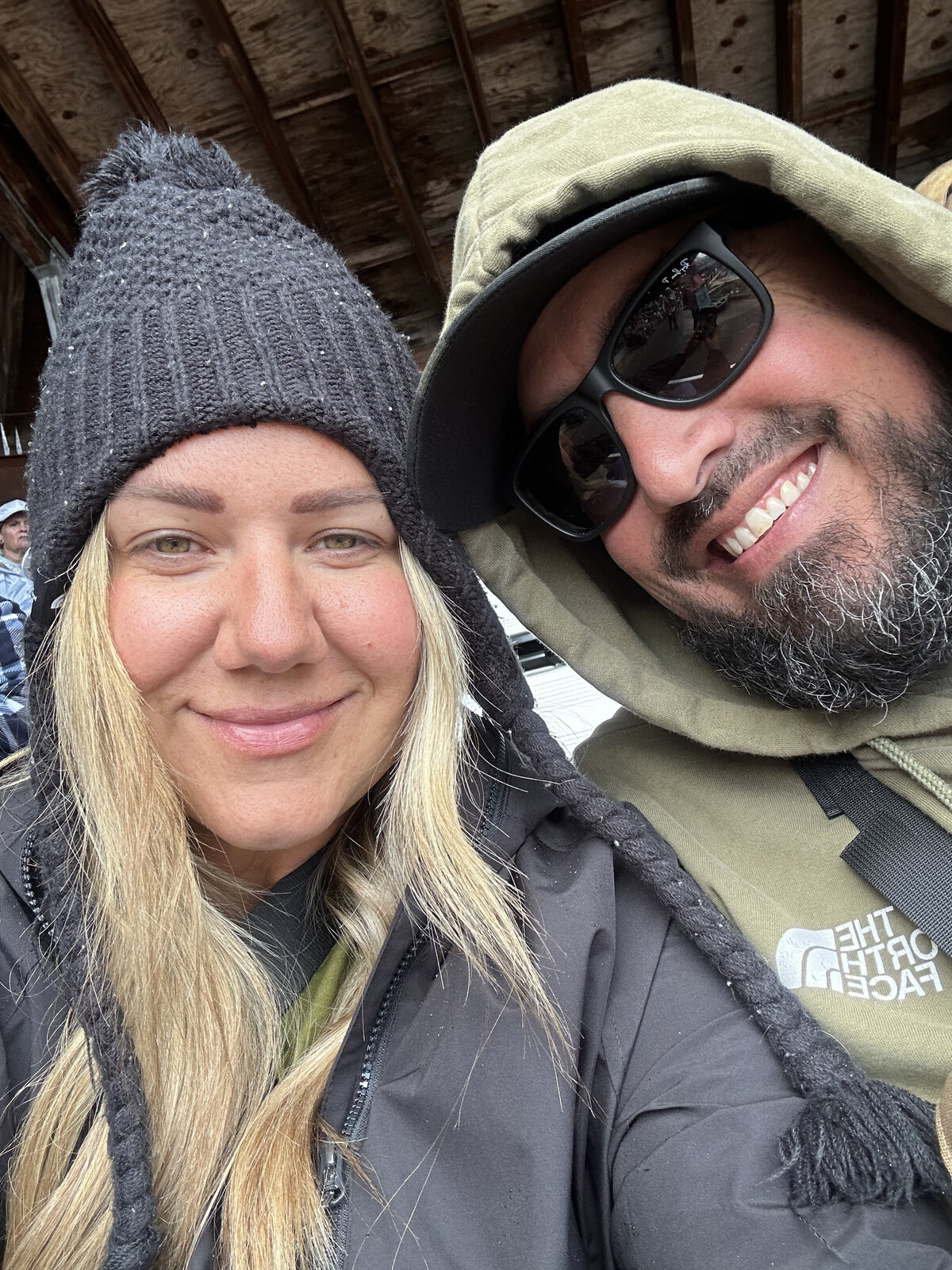 Husband and wife pose for a selfie together