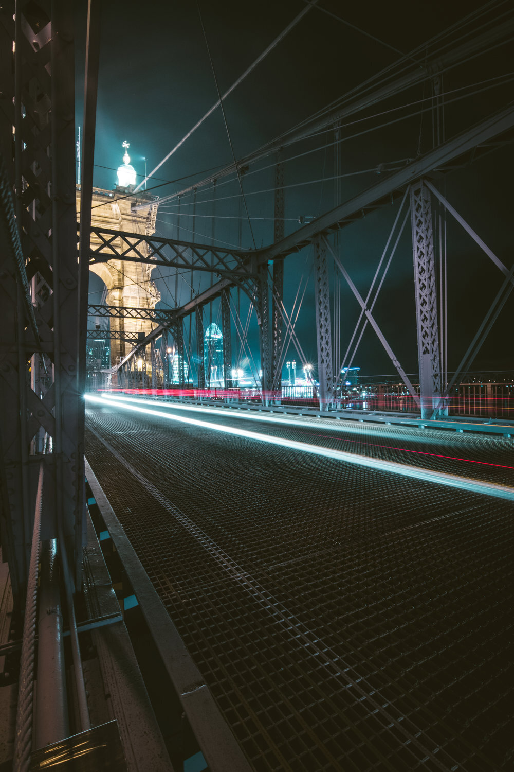 Long exposure photo of the John A Roebling suspension bridge during evening traffic. Located in Cincinnati, Ohio. Photo taken by Aaron Aldhizer