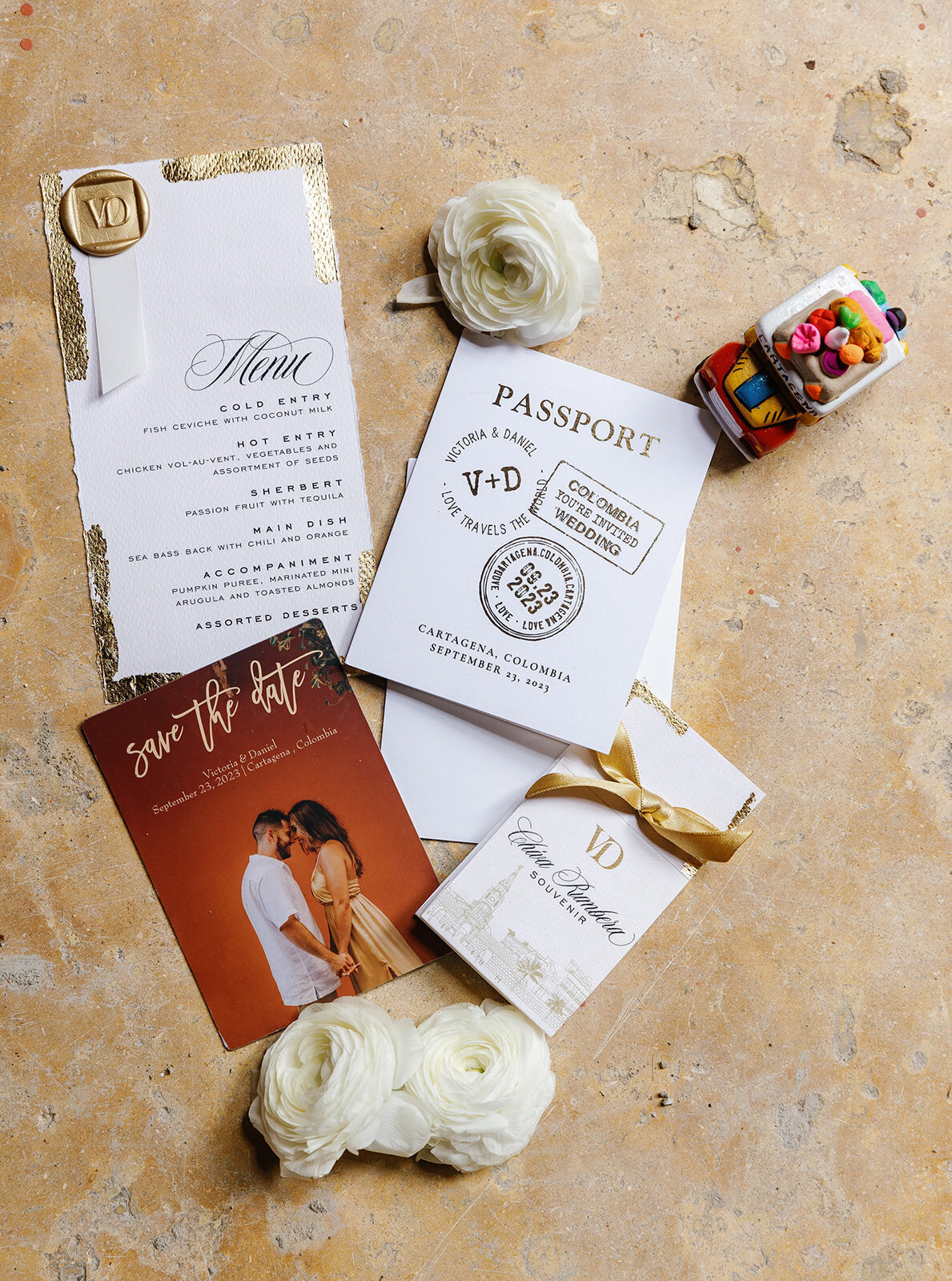 Elegant passport-style wedding invitation and details for Victoria and Daniel's Cartagena Colombia wedding, captured by Claudia Amalia Wedding Photography.