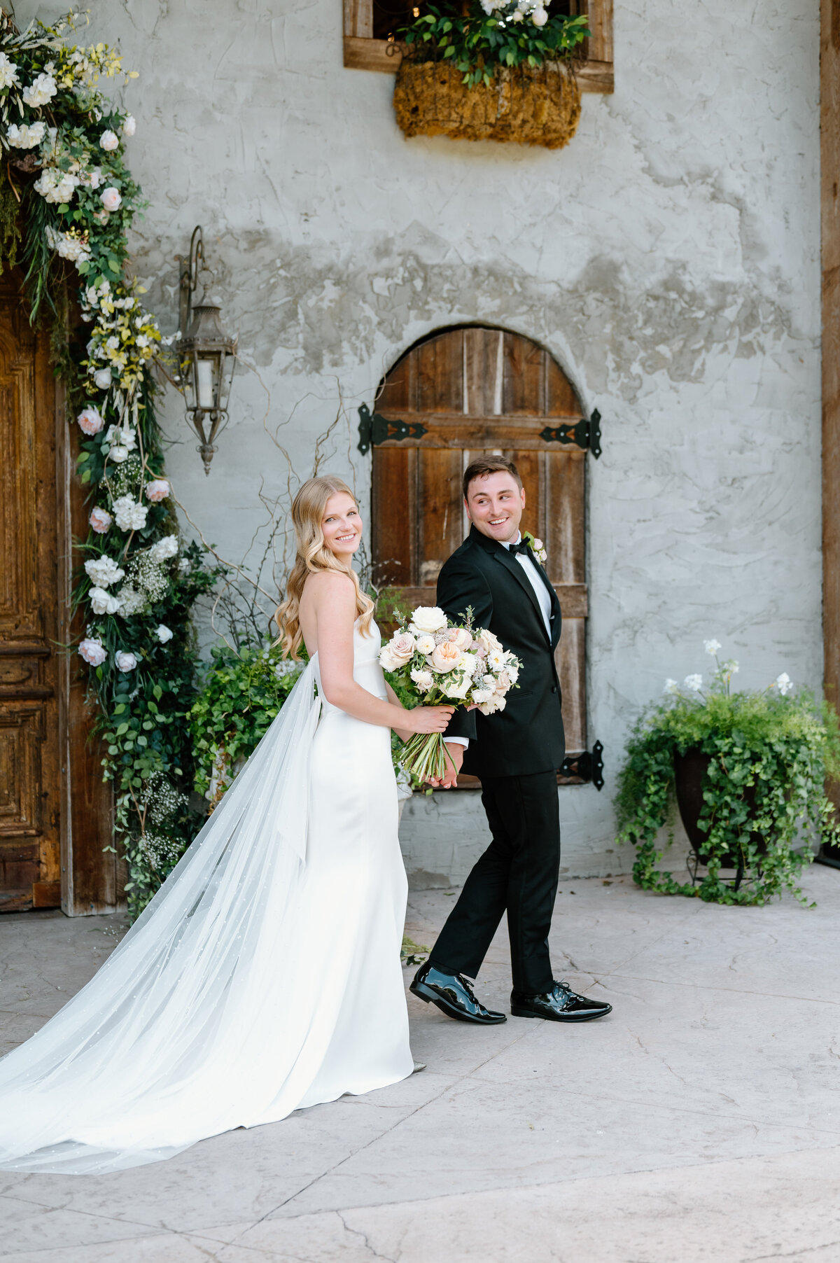 Bride and groom walking hand in hand in Nashville, Tennessee