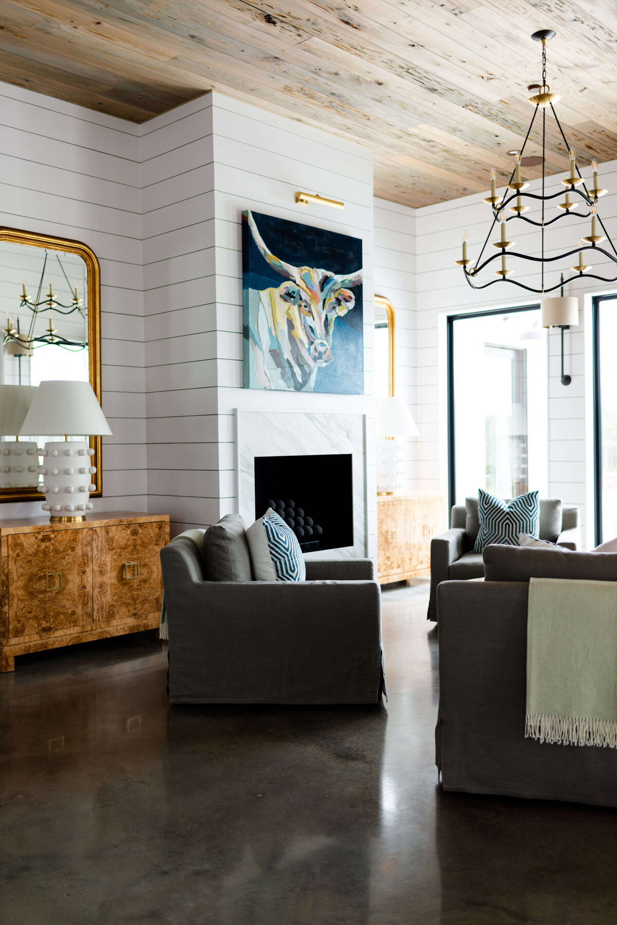 oyster creek studios building belt new build wooden accent table with large yak painting in living room